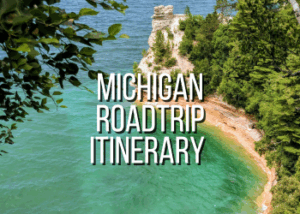 Scenic Michigan coastline with cliffs and lush greenery for summer road trip.